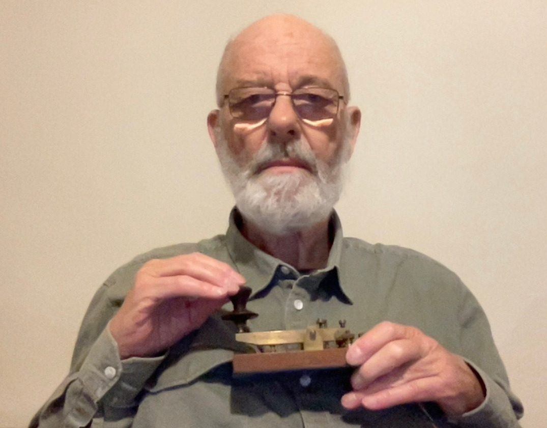 John holding morse key